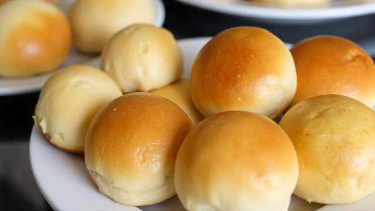 pikaso texttoimage Freshly baked bread rolls on a white plate some go