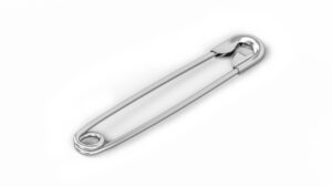 Para que serve o furo em um alfinete de segurança?