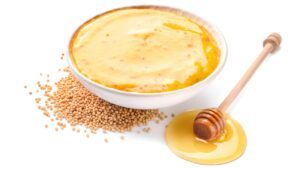 Um molho dourado que equilibra o doce suave do mel com a picância elegante da mostarda